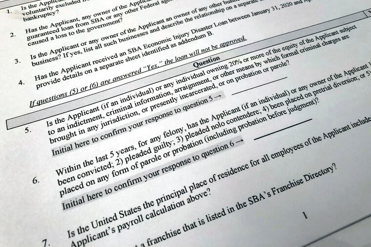 Shown is a portion of a Small Business Administration Paycheck Protection Program Borrower Application Form, Tuesday, April 21, 2020 in Washington. The Paycheck Protection was supposed to be a lifeline for small businesses, helping them stay afloat and keep their employees on the payroll during the coronavirus pandemic. But there is lots of opportunity for fraud, experts say. (AP Photo/Wayne Partlow)