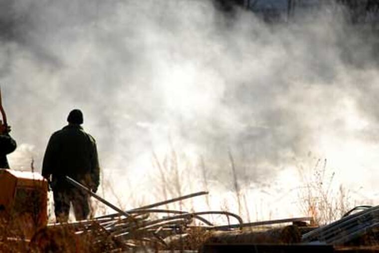 N.J. State Police bomb squad detonates explosives found along with guns and half a million rounds of ammunition on the property of a former police officer in Franklin Township. (Tom Gralish / Staff Photographer)