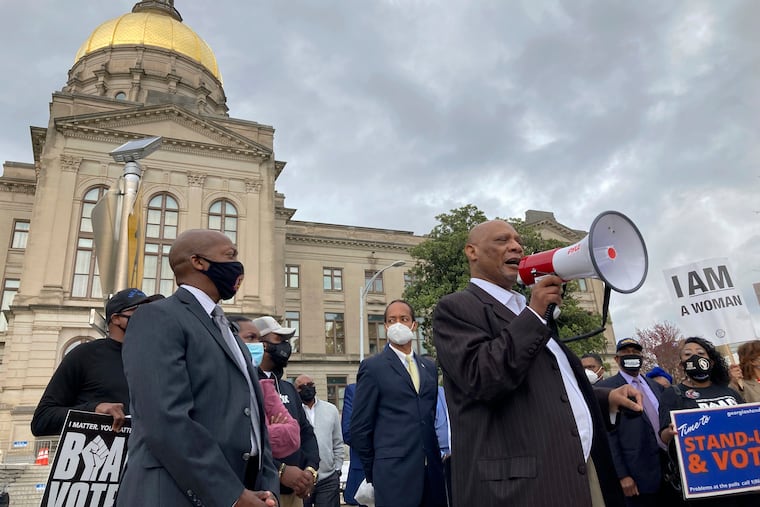 African Methodist Episcopal Church Bishop Reginald Jackson announces a boycott of Coca-Cola Co. products outside the Georgia Capitol on Thursday, March 25, 2021. Jackson says Coca-Cola and other large Georgia companies haven’t done enough to oppose restrictive voting bills that Georgia lawmakers were debating as Jackson spoke.