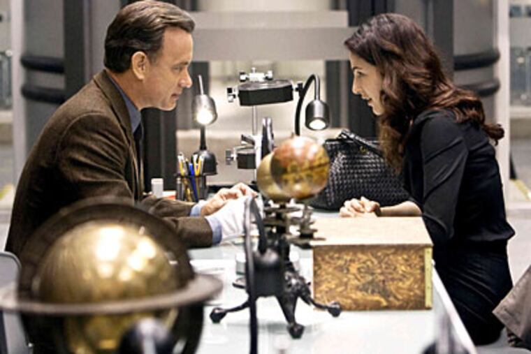 In <i>Angels & Demons</i>, Tom Hanks, as Robert Langdon, and Ayelet Zurer, as Vittoria Vetra, race to thwart a plot against the Vatican.