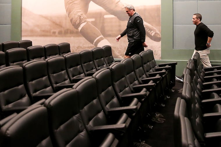 Eagles head coach Doug Pederson, left, and executive vice president of football operations Howie Roseman, right, leave after holding a news conference at the team's practice facility in Philadelphia, PA on January 15, 2019.