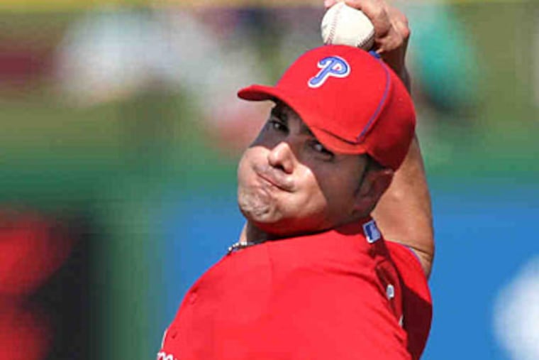 Danys Baez throws against the Orioles (David M Warren / Staff Photographer)