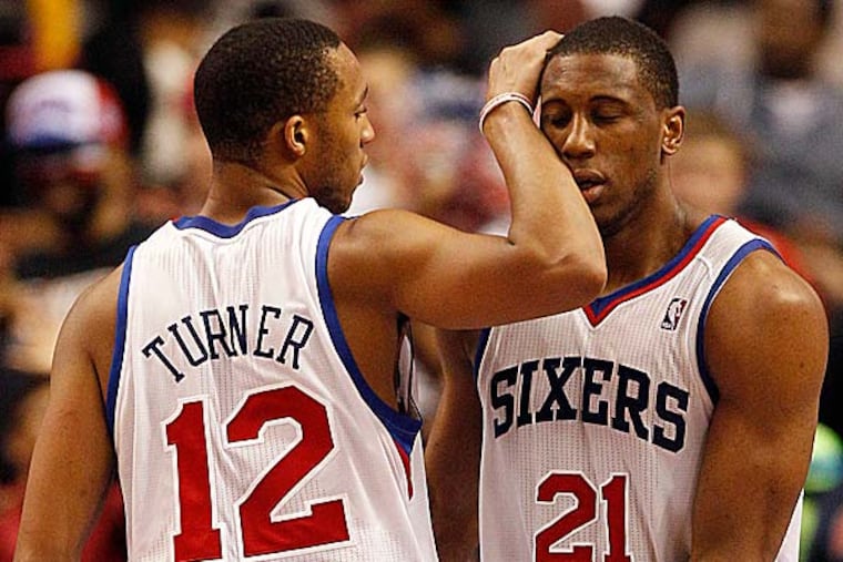 Sixers forward Thaddeus Young with teammate Evan Turner. (Yong Kim/Staff file photo)