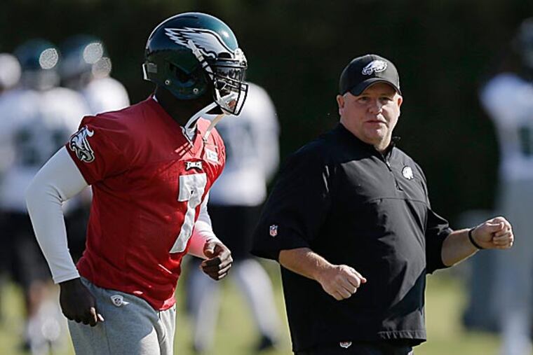 Eagles head coach Chip Kelly and quarterback Michael Vick. (Matt Rourke/AP)