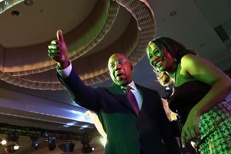 U.S. Sen. Raphael Warnock (D-Georgia) celebrates during an election night watch party at the Marriott Marquis in Atlanta.