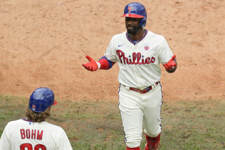 Phillies left fielder Andrew McCutchen reacts after hitting a two-run homer in the sixth inning of Sunday's 6-2 victory over the New York Mets at Citizens Bank Park.