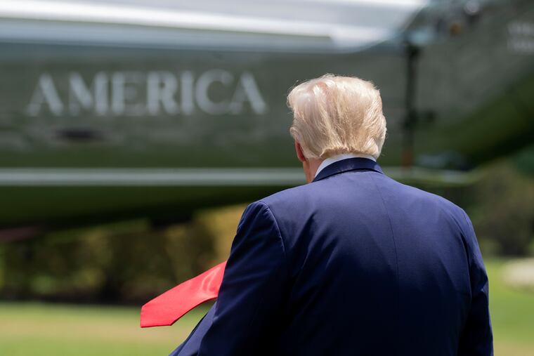 President Donald Trump walking across the South Lawn of the White House to board Marine One earlier this month.