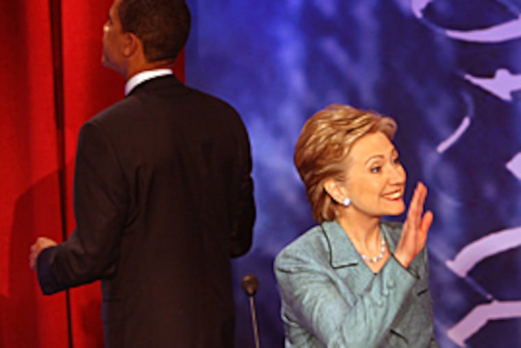 Sen. Hillary Clinton waves to her daughter after the debate, as Sen. Barack Obama walks off to visit the audience. (Michael Bryant / Inquirer)