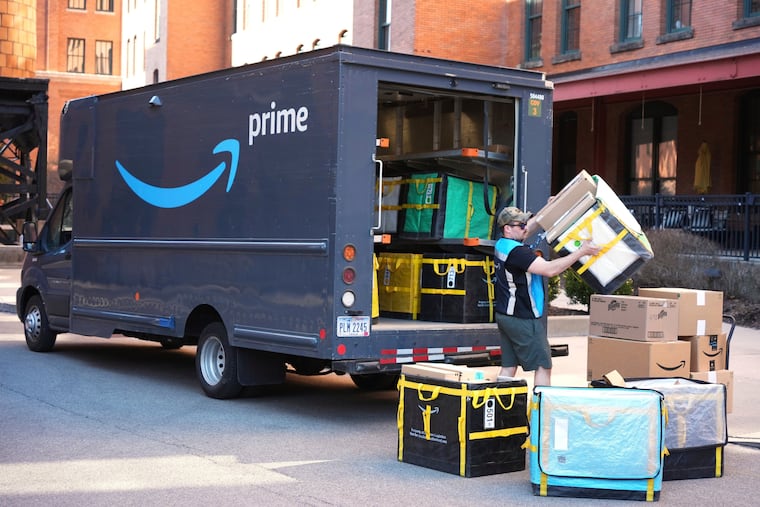An Amazon driver makes a delivery outside an apartment building in Pittsburgh, March 10, 2025.