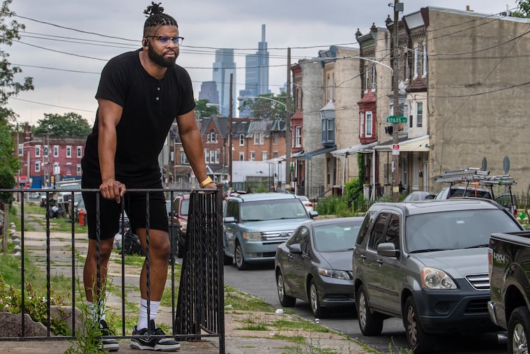 Angelo Goodwin, rental property owner, looks on Monday, June 27, 2022., near one of his rental properties in Leidy Ave,Philadelphia, Pa. A former manager at Comcast has become a real estate investor who works with nonprofits to house people his colleagues consider risky and who struggle to find housing.