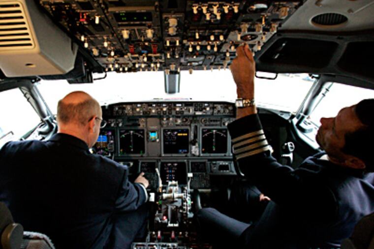 The president's budget would cut by half funding to train pilots and other flight deck crew in the use of firearms. (Donna McWilliam / Associated Press)