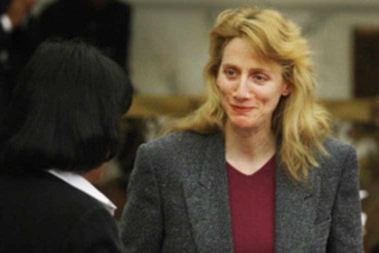 Councilwoman Janie Blackwell (left) helps honor Alexander in City Council on Oct. 30. Her book is at left.