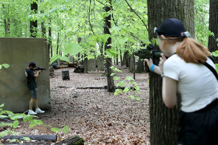 Christian Deane (left) and Samantha Krall (right), play laser tag at Fireball Mountain in Wrightstown, N.J. on Sunday, May 15, 2022.