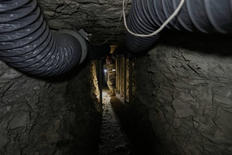 Lebanese army soldiers walk through a tunnel dug into a mountain that was used by Hezbollah militants as a clinic and storage facility near the Lebanese-Israeli border in the Zibqin Valley, southern Lebanon, Nov. 28, 2025.