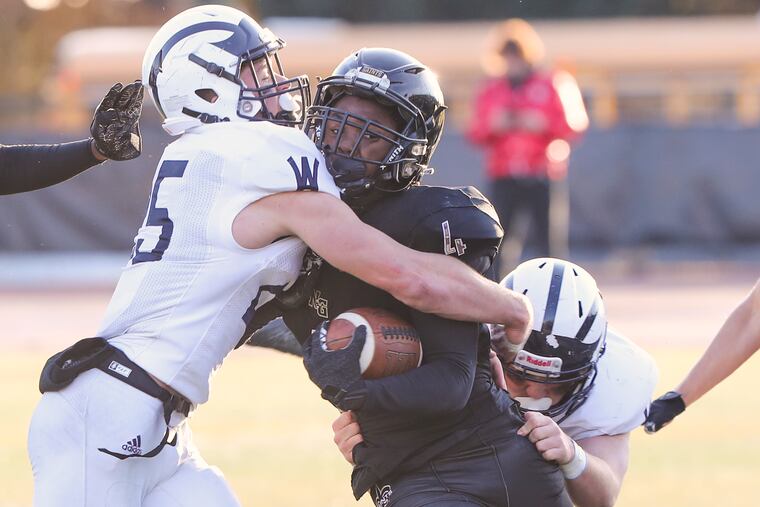 Neumann-Goretti defensive back Khari Reid (4) with the ball during a PIAA semifinal game against Wyomissing at the Germantown Supersite in Philadelphia on Saturday, Dec. 3, 2022. Reid committed to Stanford.
