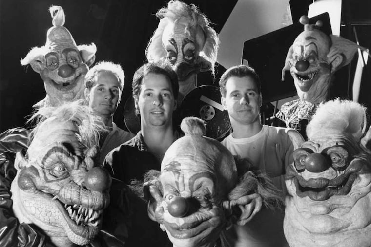 The Chiodo brothers (from left) Stephen, Edward, and Charles, surrounded by the titular aliens in their 1988 cult classic, "Killer Klowns from Outer Space."