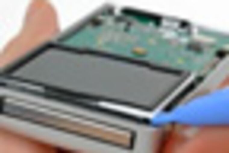 the teardown of the iflip video camera. in step 8 of the instructions, Use a plastic opening tool to carefully lift the top edge of the display out of its bracket. It may be necessary to use a metal spudger to release a small piece of film stuck between the LCD and the display bracket.