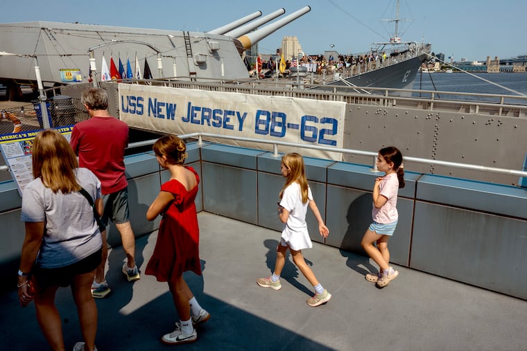 The Luttrell family from Flourtown, Pa. visits the Battleship New Jersey as a press conference takes place on deck Wednesday, Aug. 12, 2026 to announce the museum’s multimillion-dollar renovation. The two-year project supported by the New Jersey Economic Development Authority’s Cultural Arts Facilities Expansion (CAFE) Program will upgrade parts of the Big J campus that haven't seen improvements since the battleship opened to the public 25 years ago. Improvements will include a 3-story visitor center, double the parking, and more with $24 million upgrades.