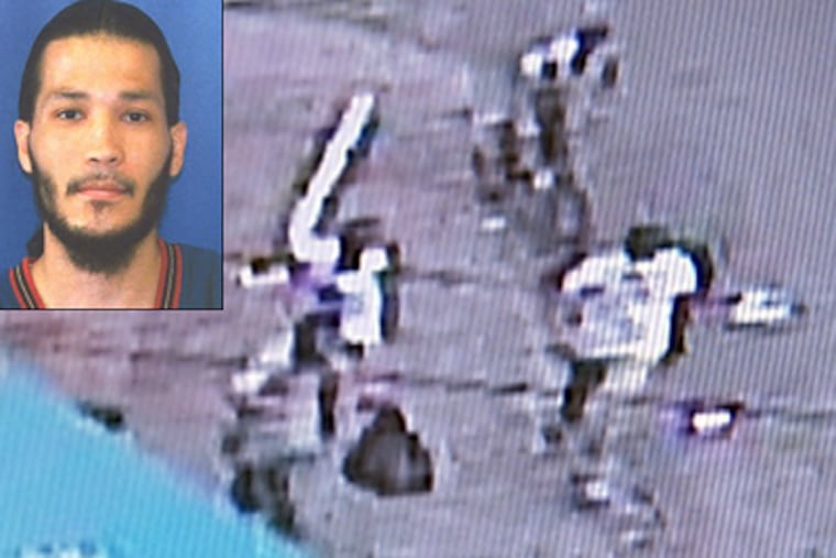 This corner-store camera video shows Jose Carrasquillo (inset) carrying a black bag Tuesday just before he was chased on Clearfield Street, caught and beaten. The attack left him in critical condition at Temple University Hospital. Police were thanking the locals for helping them catch “a person of interest.” (Courtesy Fox 29)