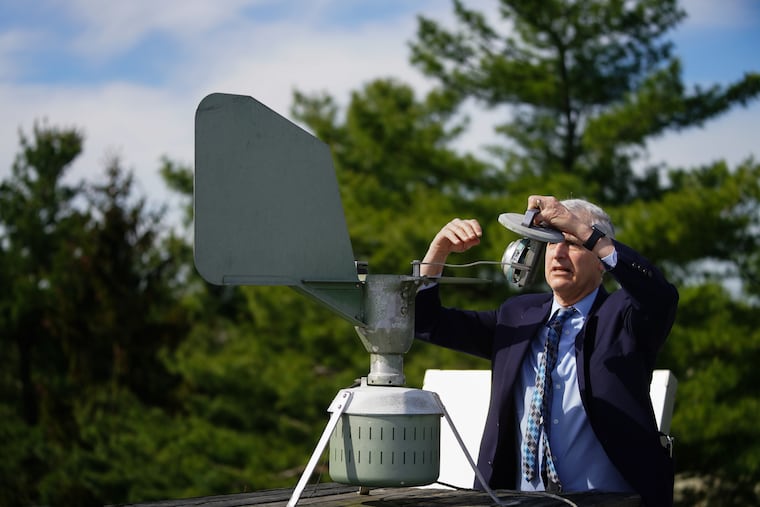 Dr. Donald Dvorin collecting a pollen sample from a trap on the roof of his practice, in Mount Laurel in 2021. Tree pollen has been evident around here, and the grasses are joining the party.