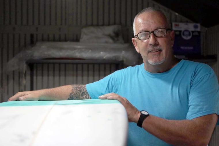 Luke Alvarez, a Cherry Hill middle-school teacher, also owns Generic Brand Surfboards, where he creates custom-made boards in two sheds behind his Shore home in Tuckerton Beach.