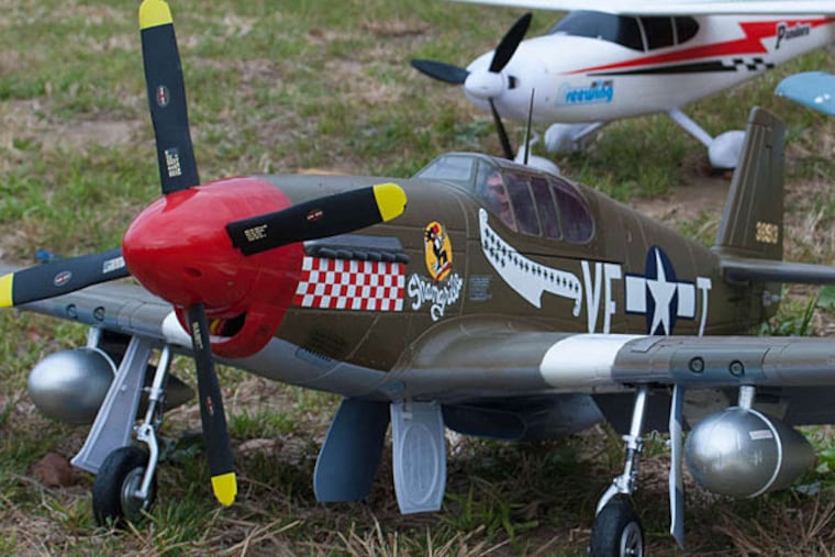 This plane even comes with a miniature crew, although the real flying is done with a radio-control box. SARA NACHMAN / STAFF PHOTOGRAPHER