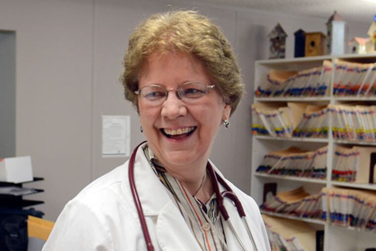 Dr. Alieta Eck (right), Republican candidate for Senate talks a with patient, July 29, 2103, in office at the Zarephath Health Center free clinic she operates in Somerset. Eck is running for Congress in 2014. ( TOM GRALISH / Staff Photographer )