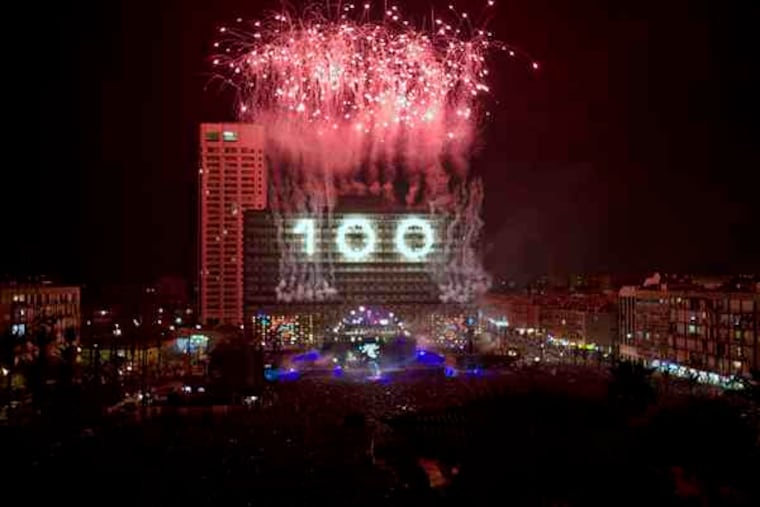 Fireworks marked the 100th birthday of Tel Aviv on Saturday. Israel's second-largest city, built on Mediterranean dunes, is hardened to the shocks of conflict. "The nightlife here is crazier than anywhere in the world," said a pub owner.