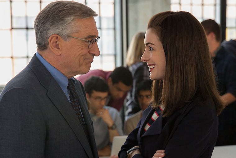 Robert De Niro, as a septuagenarian widower, interns at a start-up run by Anne Hathaway, a workaholic millennial, in "The Intern." Warner Bros.
