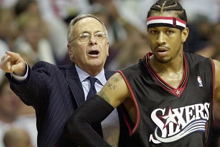 Larry Brown instructs his team alongside guard Allen Iverson on May 6, 2003. (AP Photo/Paul Sancya)