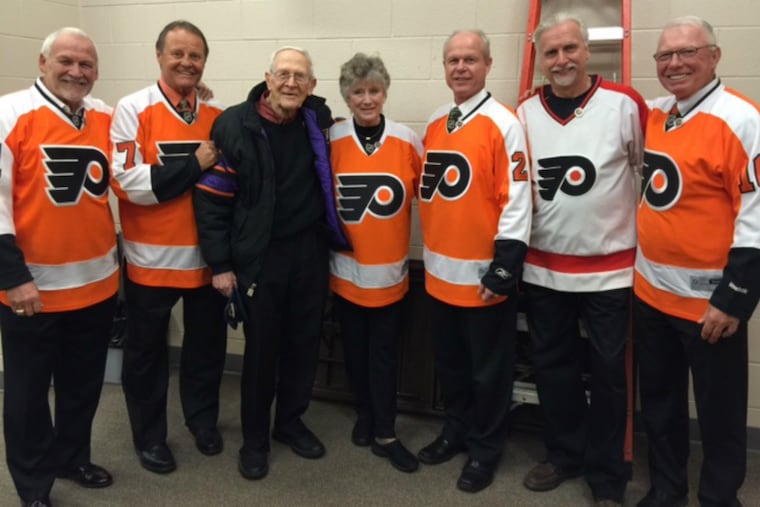 From left are: Bernie Parent, Bill Barber, 95-year-old fan Ed Weinrott, Donna Ashbee (wife of the late Flyer, Barry), Mark Howe, longtime ticketholder Joe Sahina and Bobby Clarke.