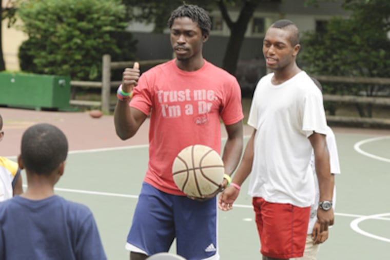 Counselors Lamin Conteh (left) and Talvon Brown at College Settlement Camp in Horsham. (Ron Tarver / Staff Photographer)