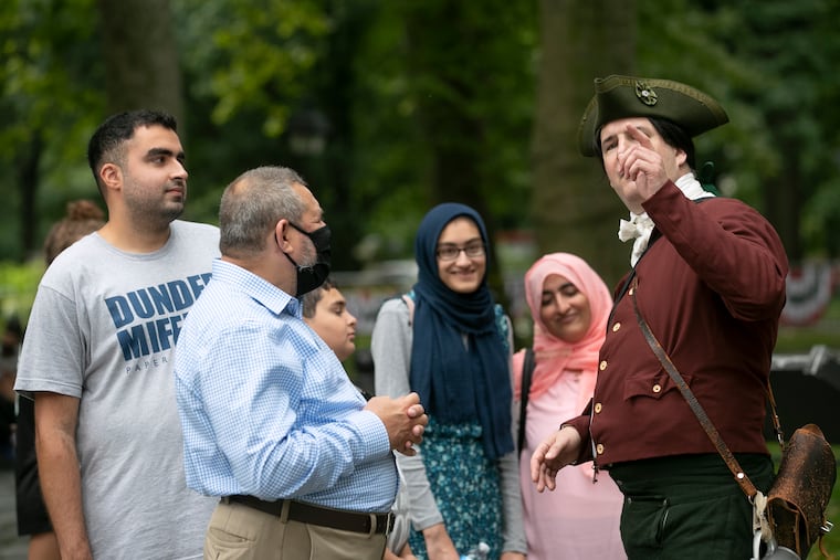 John Dunlap, portrayed by Doug Thomas, helps give directions.