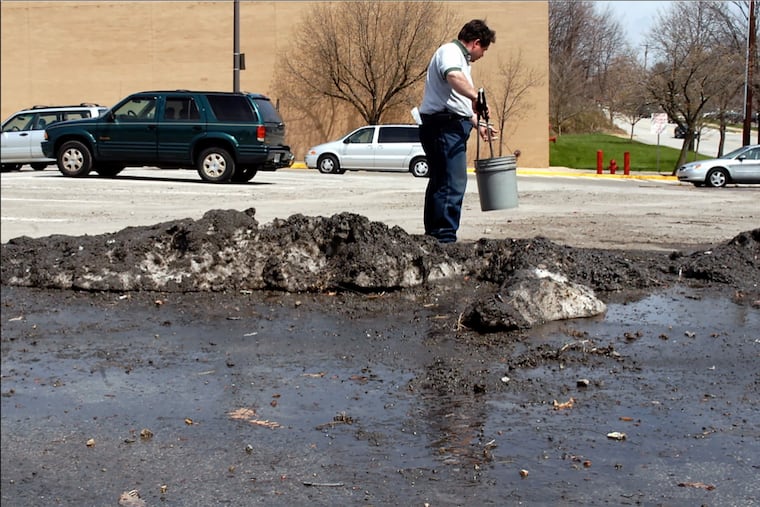 On April 6 a worker picked up trash around the last frozen remnant of what was once a parking lot mountain range of plowed snow. The last flake of snow from the winter of 2004-05 melted Friday into its final puddle. At its most impressive moment, after a Feb 28 snowfall, this Alp of Andorra at Ridge and Henry Avenues was 21 feet high, 77 feet deep, and 112 feet across.