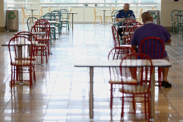 Dining tables are spaced out at Philadelphia International Airport.