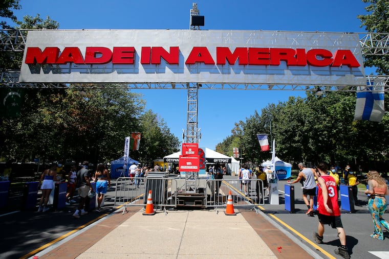 Music fans enter the Made In America music festival at the Philadelphia Museum of Art along the Benjamin Franklin Parkway on Sept. 4, 2021.