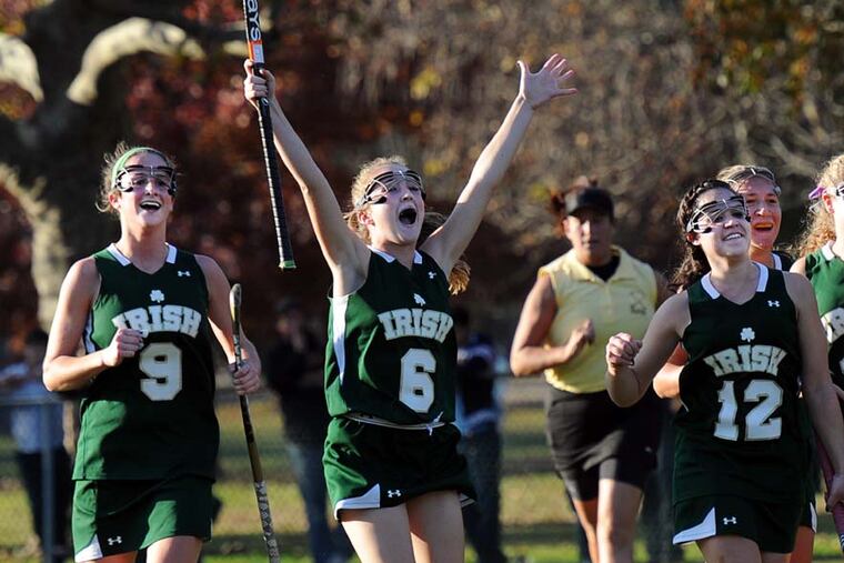 Camden Catholic beat Collingswood, 4-0, for the Central Jersey Group 2 field hockey championship. Celebrating their victory are (from left) Tara Vittese, who scored two of the goals, Brianna Cahill and Danielle Frasca.
