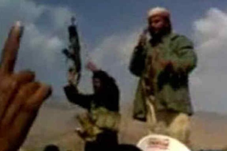 In the image at right taken from extremist Web sites, a man delivers a eulogy for extremists killed in an undated Yemeni air strike. Above, Umar Farouk Abdulmutallab.