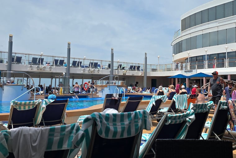 Vacationers lounge next to the main pool aboard the Norwegian Jewel during a recent cruise from Philadelphia to Bermuda.