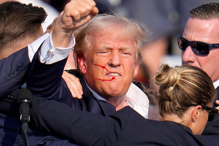 Donald Trump reacts following an assassination attempt at a campaign event in Butler, Pa., on July 13.