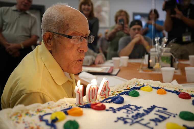 Fred Gomez, 104, blows out the candles on his birthday cake at the Central Bucks Senior Activity Center in Doylestown on Wednesday.
