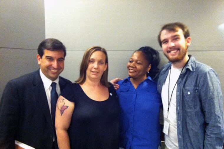 Noelle Bilbrough (second from left) and her support team: (from left) public defender Christopher J. Angelo; Denita Washington, resource coordinator; and case worker Ryan Flynn. Bilbrough was among those honored Thursday. (Joseph A. Slobodzian/Inquirer Staff)
