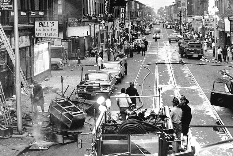 In 1964, a view of Columbia Avenue - now Cecil B. Moore Avenue - looking west from 15th Street shows heavy damage from the rioting and looting. A false rumor that police had beaten a pregnant woman to death helped fuel the anger.