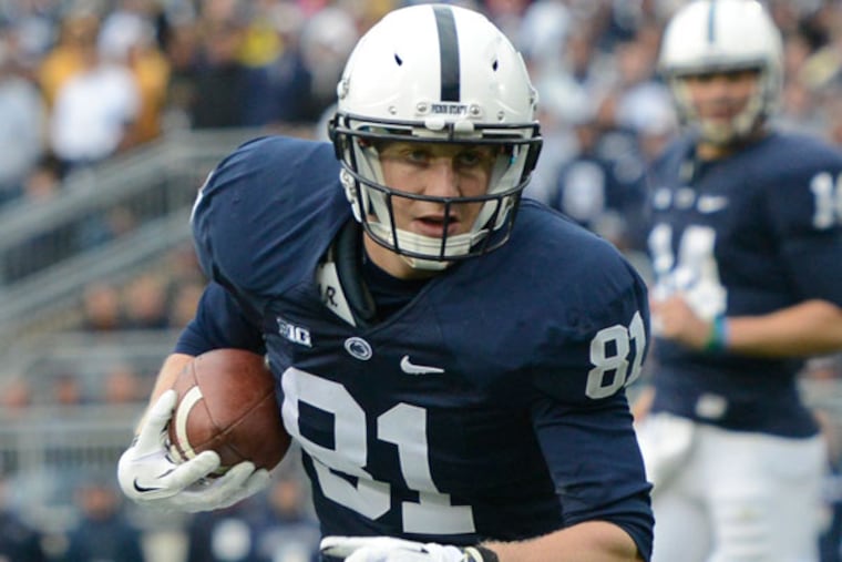 Penn State tight end Adam Breneman (81) carries the ball in the fourth quarter of an NCAA college football game against Illinois in State College, Pa., Saturday, Nov. 2, 2013. (John Beale/AP)