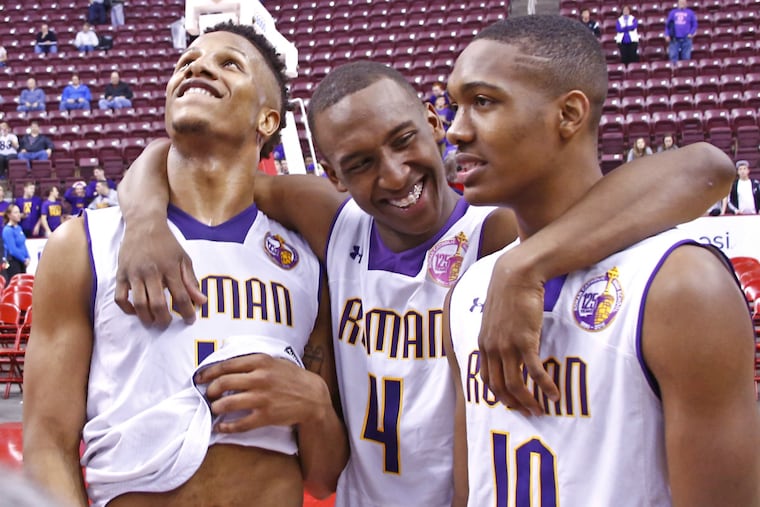 Roman Catholic teammates (from left) Lamar Stevens, Nazeer Bostick, and Tony Carr celebrate after the Cahillites won the PIAA Class AAAA boys basketball championship.