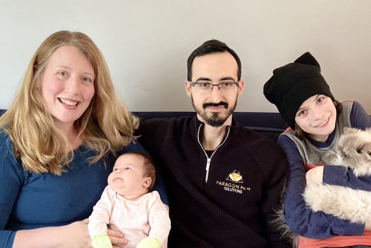 Photo by Joan Vidal.
Photo IDs: Anne Medrano and Dan Vidal with baby Mia, son Jackson and beloved Himalayan cat Sabrina.