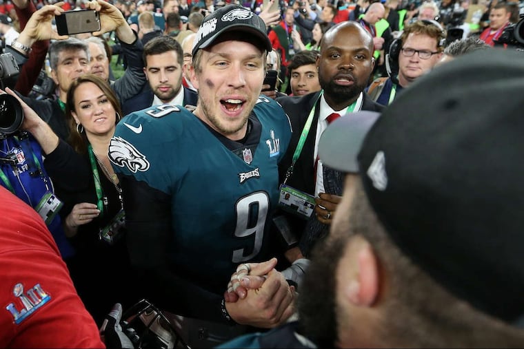 Eagles quarterback Nick Foles celebrates with Eagles center Jason Kelce after Super Bowl LII, at U.S. Bank Stadium in Minneapolis, Minnesota, Sunday, Feb. 4, 2018. The Eagles won 41-33.