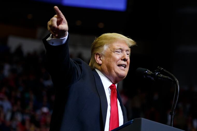President Trump speaks Monday during a campaign rally for Sen. Ted Cruz, R-Texas, in Houston.<br/>
EVAN VUCCI / AP