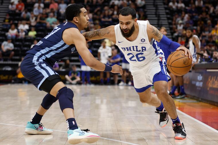 Sixers guard Grant Riller dribbles against Memphis Grizzlies guard Tremont Waters during the second half of an NBA summer league game.