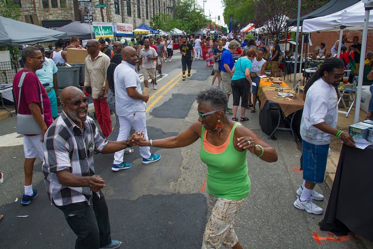 William Cropper, 78, and his sister Carol Nael, 72, dancing at the 2015 Odunde Festival ( CLEM MURRAY / Staff Photographer )